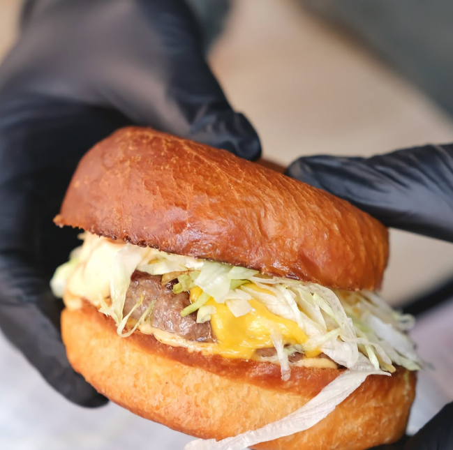 a juicy burger served at Glorias Fast Food in Bonnyrigg