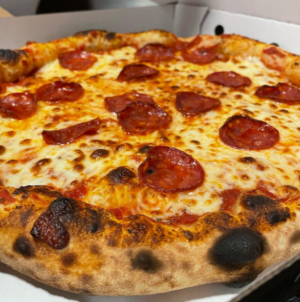 a cheesy pizza served at Glorias Fast Food in Bonnyrigg